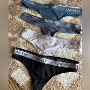 LOT of four (4) Calvin Klein bikini thongs NWOT panties underwear